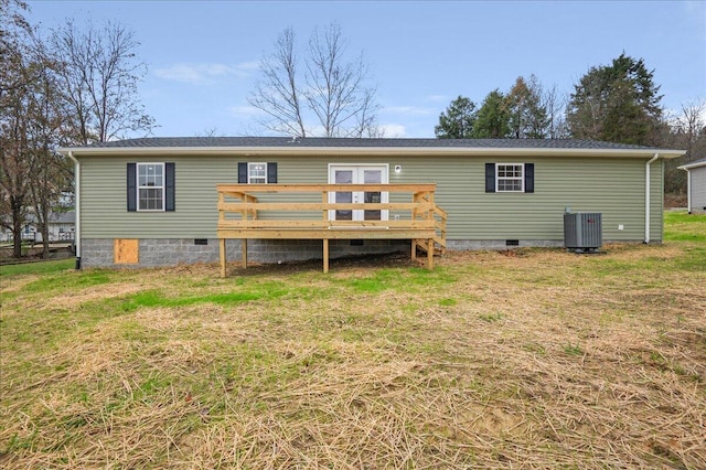 back of house featuring cooling unit, a yard, and a wooden deck