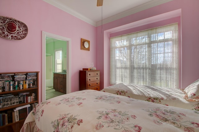 bedroom featuring ceiling fan, ornamental molding, and ensuite bath