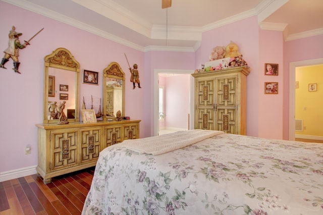 bedroom with connected bathroom, dark wood-type flooring, and ornamental molding