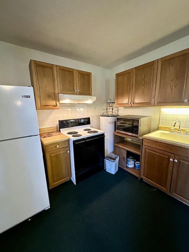 kitchen featuring range with electric cooktop, sink, white fridge, and electric water heater