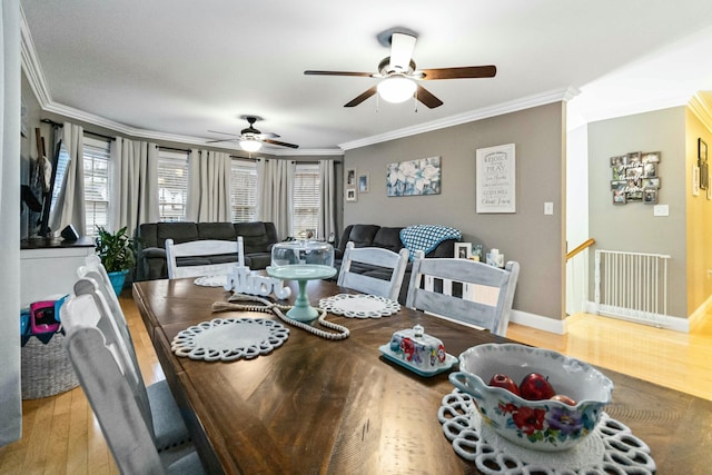 dining room featuring ceiling fan, light hardwood / wood-style floors, and ornamental molding