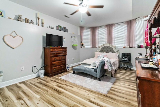 bedroom featuring light hardwood / wood-style flooring and ceiling fan