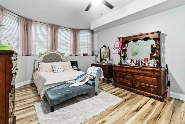 bedroom with light hardwood / wood-style floors and ceiling fan