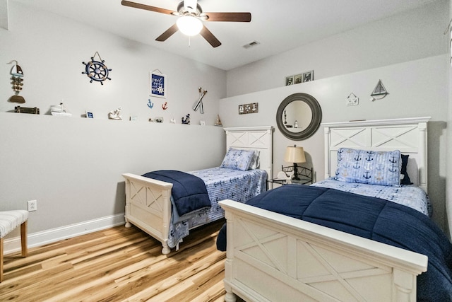 bedroom featuring ceiling fan and wood-type flooring