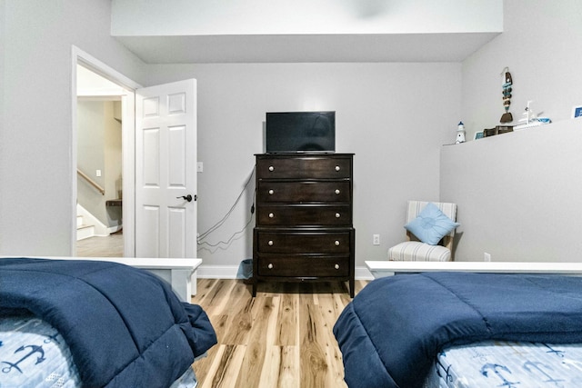 bedroom with light hardwood / wood-style flooring