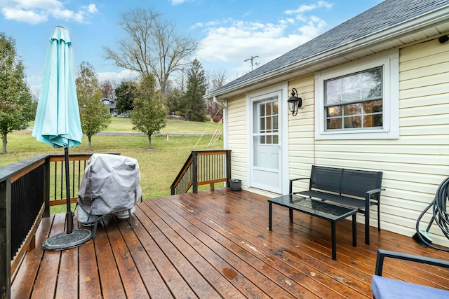 wooden terrace featuring an outdoor living space and a lawn