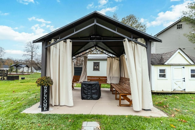 view of outdoor structure featuring a gazebo and a lawn