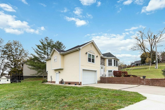 view of home's exterior featuring a yard and a garage