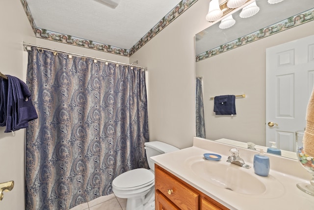 bathroom with a shower with curtain, tile patterned floors, a textured ceiling, toilet, and vanity