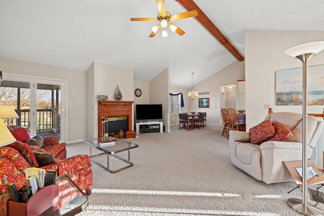 living room with carpet, beam ceiling, ceiling fan with notable chandelier, and high vaulted ceiling