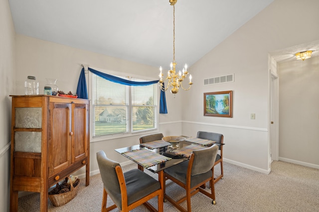 carpeted dining area featuring lofted ceiling and an inviting chandelier