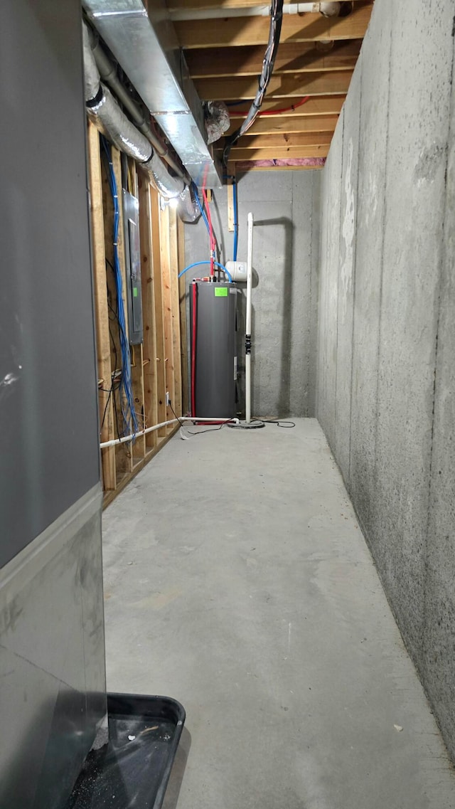 basement with electric panel and water heater