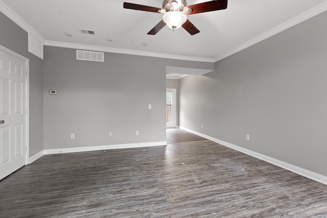 spare room with dark hardwood / wood-style floors, ceiling fan, and ornamental molding