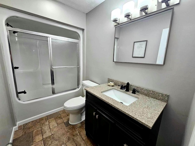 full bathroom with vanity, enclosed tub / shower combo, and toilet