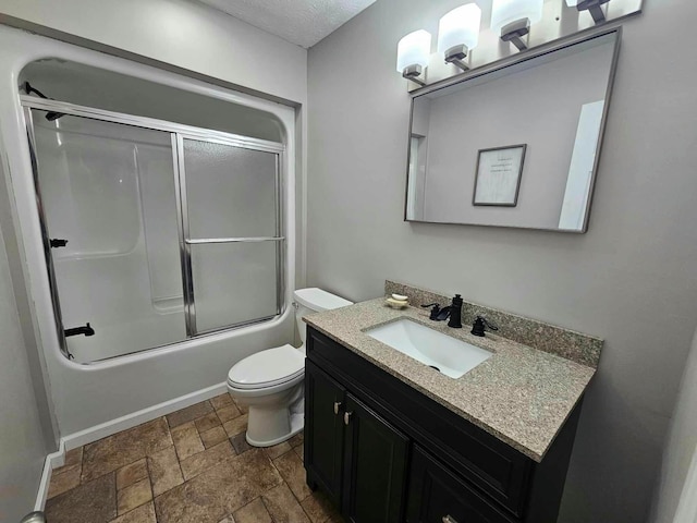 full bathroom with combined bath / shower with glass door, vanity, and toilet