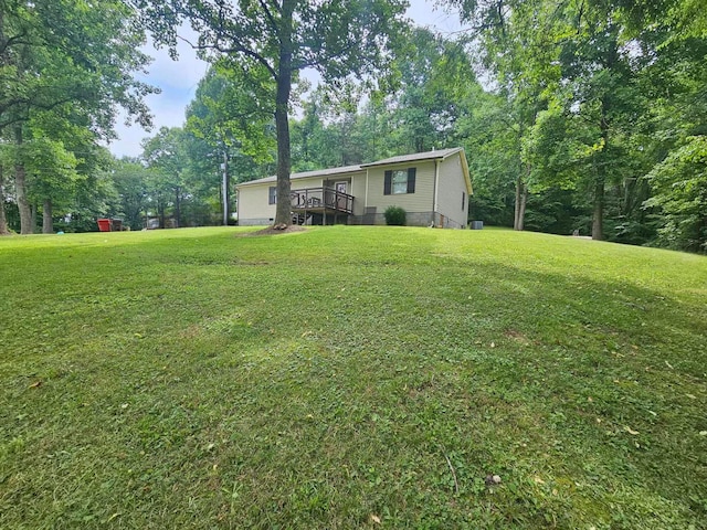 view of yard with a deck