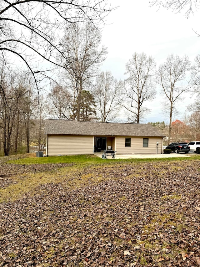 ranch-style house with central air condition unit