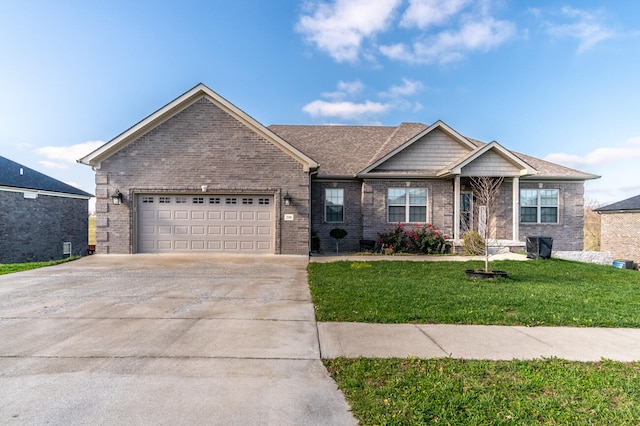 view of front of property with a front lawn and a garage