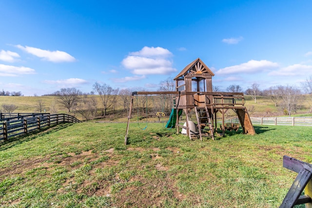 view of jungle gym featuring a yard and a rural view