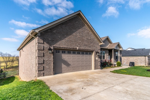 view of front of house with a garage and a front lawn