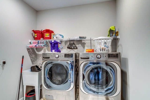 clothes washing area with independent washer and dryer