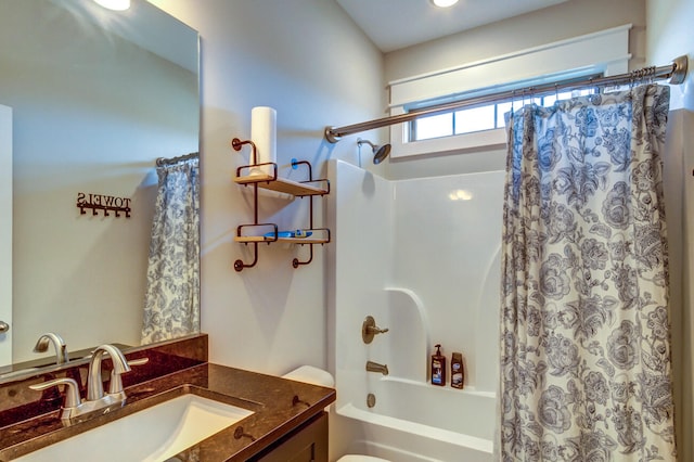 full bathroom featuring shower / tub combo with curtain, vanity, and toilet