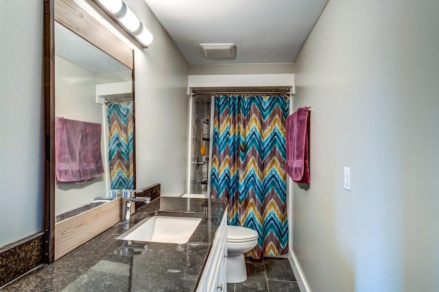 bathroom featuring vanity, toilet, and curtained shower