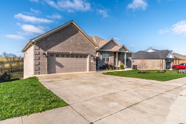 view of front facade with a garage and a front lawn