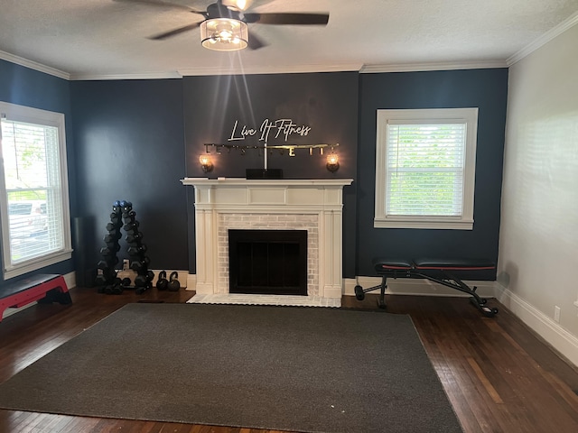 unfurnished living room featuring dark hardwood / wood-style floors, ceiling fan, crown molding, and a wealth of natural light