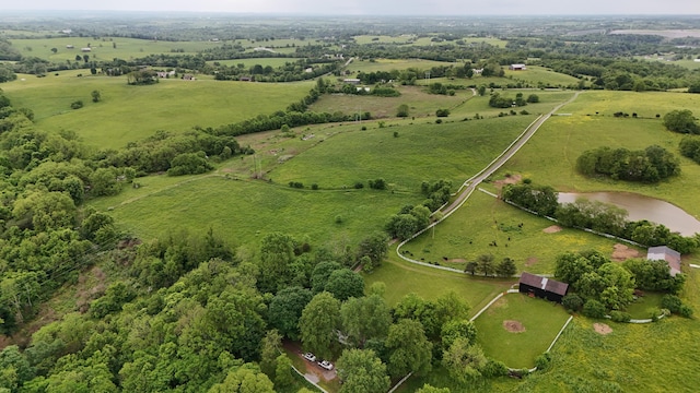 aerial view featuring a rural view and a water view