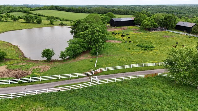 drone / aerial view featuring a rural view and a water view