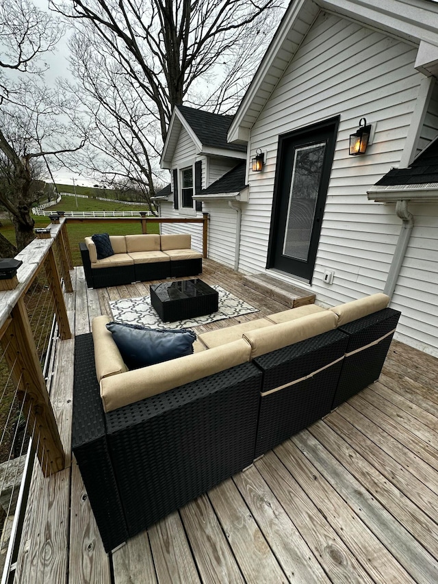 wooden terrace featuring an outdoor living space