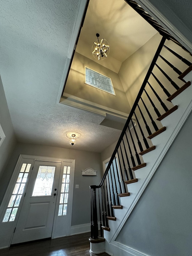 2458 High Bridge Rd, Lancaster, KY 40444 - entryway featuring stairway, wood finished floors, a textured ceiling, a chandelier, and baseboards