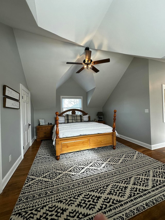 bedroom featuring ceiling fan, dark hardwood / wood-style floors, and lofted ceiling