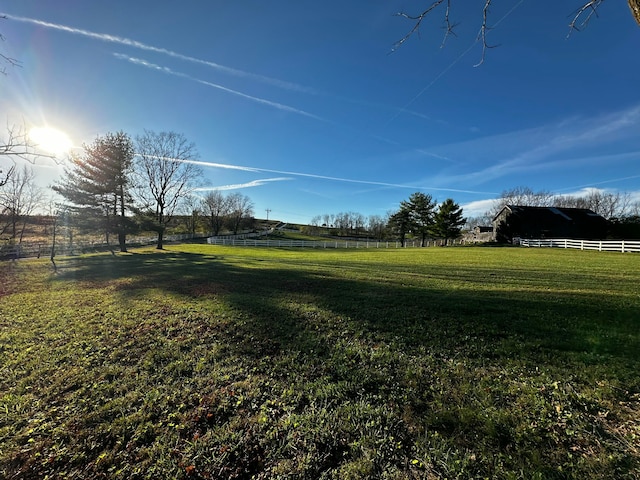 view of yard with a rural view