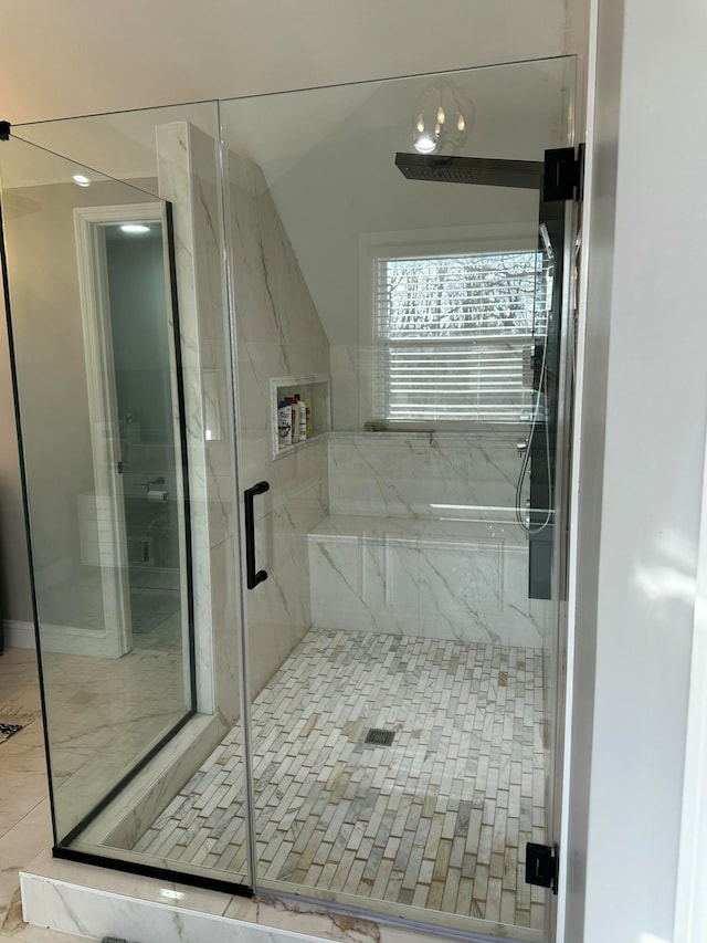 bathroom with tile patterned floors and a shower with door