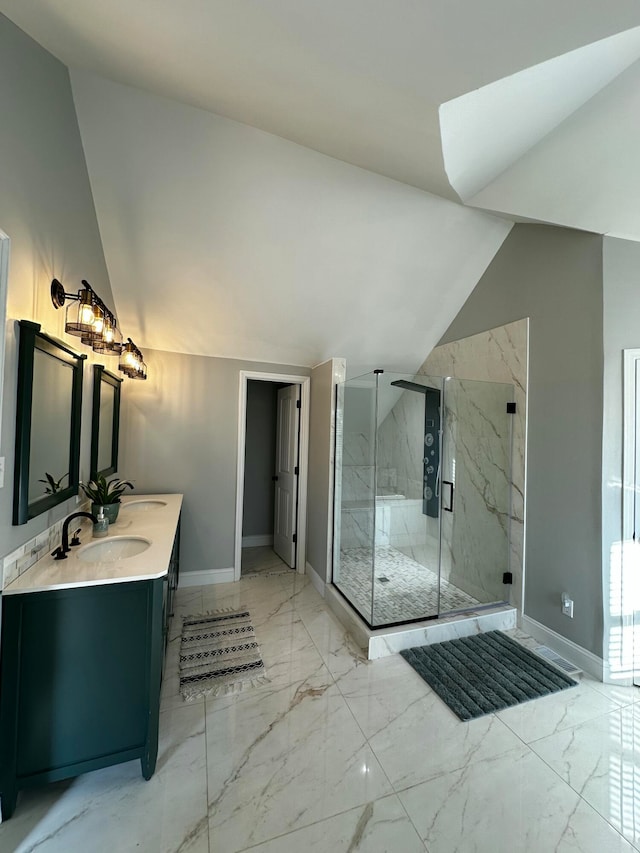 bathroom with vanity, vaulted ceiling, and a shower with door