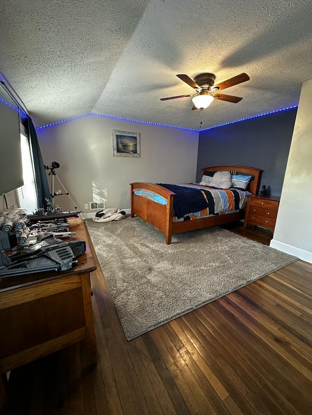 2458 High Bridge Rd, Lancaster, KY 40444 - bedroom featuring a textured ceiling, ceiling fan, wood finished floors, lofted ceiling, and baseboards