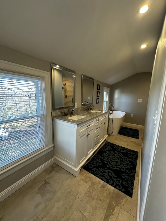 2458 High Bridge Rd, Lancaster, KY 40444 - bathroom featuring a freestanding bath, double vanity, baseboards, lofted ceiling, and a shower with shower door