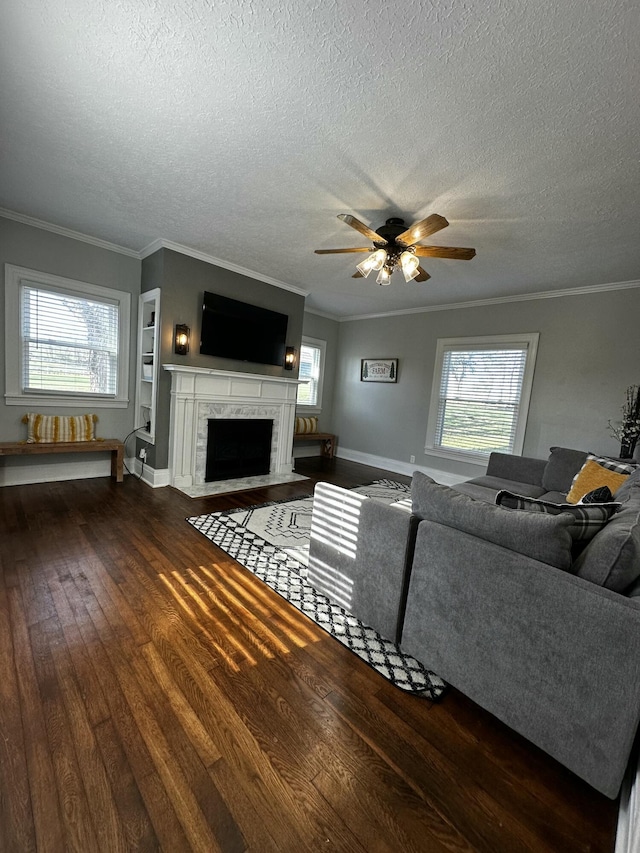 2458 High Bridge Rd, Lancaster, KY 40444 - living room with wood finished floors, a textured ceiling, ornamental molding, a fireplace with flush hearth, and ceiling fan