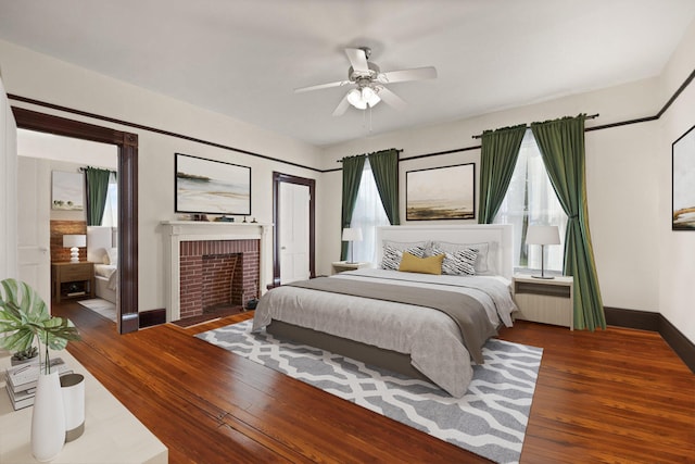 bedroom featuring multiple windows, ceiling fan, and dark wood-type flooring