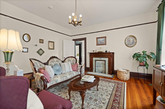 living room with a chandelier and hardwood / wood-style floors