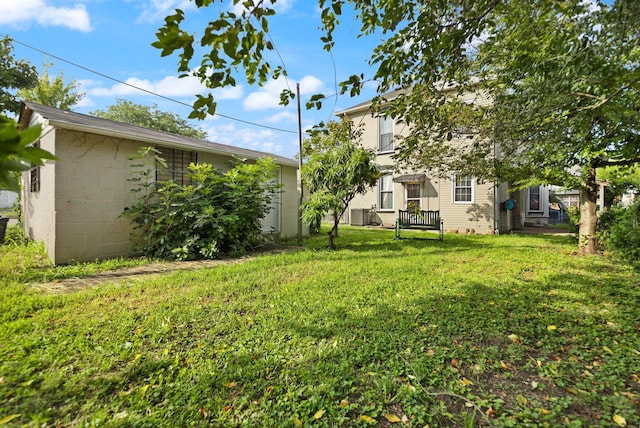 view of yard with central AC