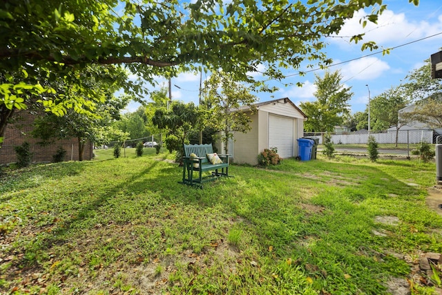 view of yard with an outbuilding and a garage