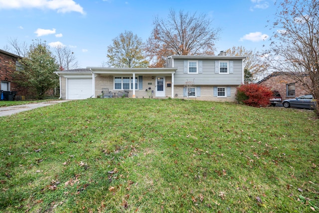 split level home featuring a porch, a garage, and a front yard