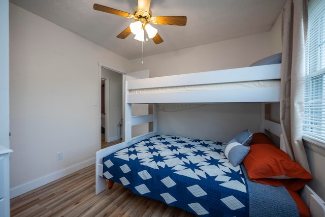 bedroom with ceiling fan and wood-type flooring