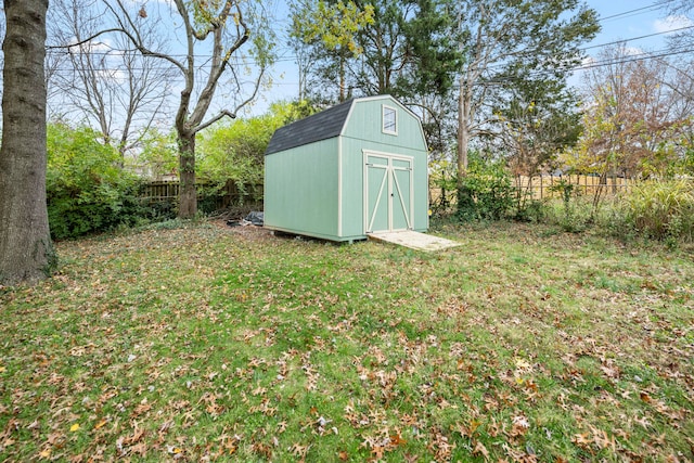 view of outbuilding with a lawn