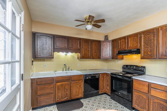 kitchen with backsplash, a textured ceiling, ceiling fan, sink, and black appliances