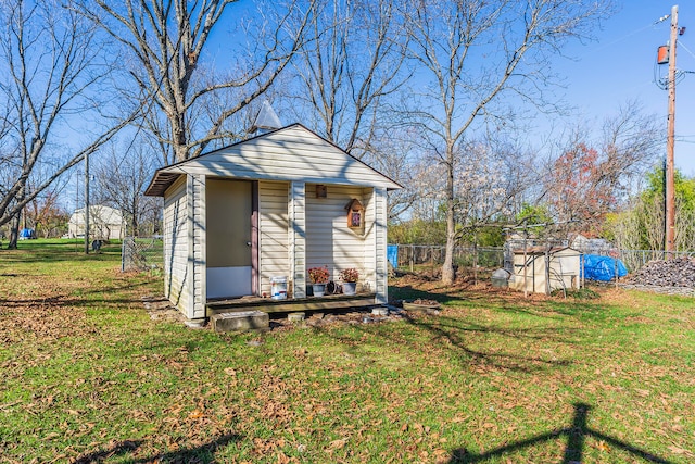 view of outbuilding featuring a yard