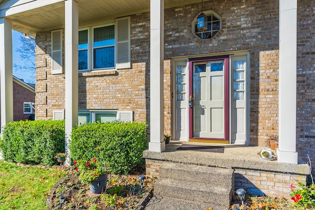 view of exterior entry with covered porch